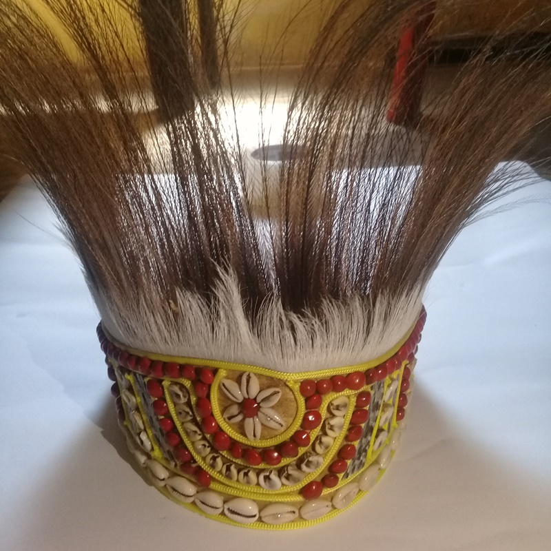 topi adat papua